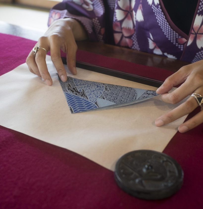 woman-making-origami-with-japanese-paper